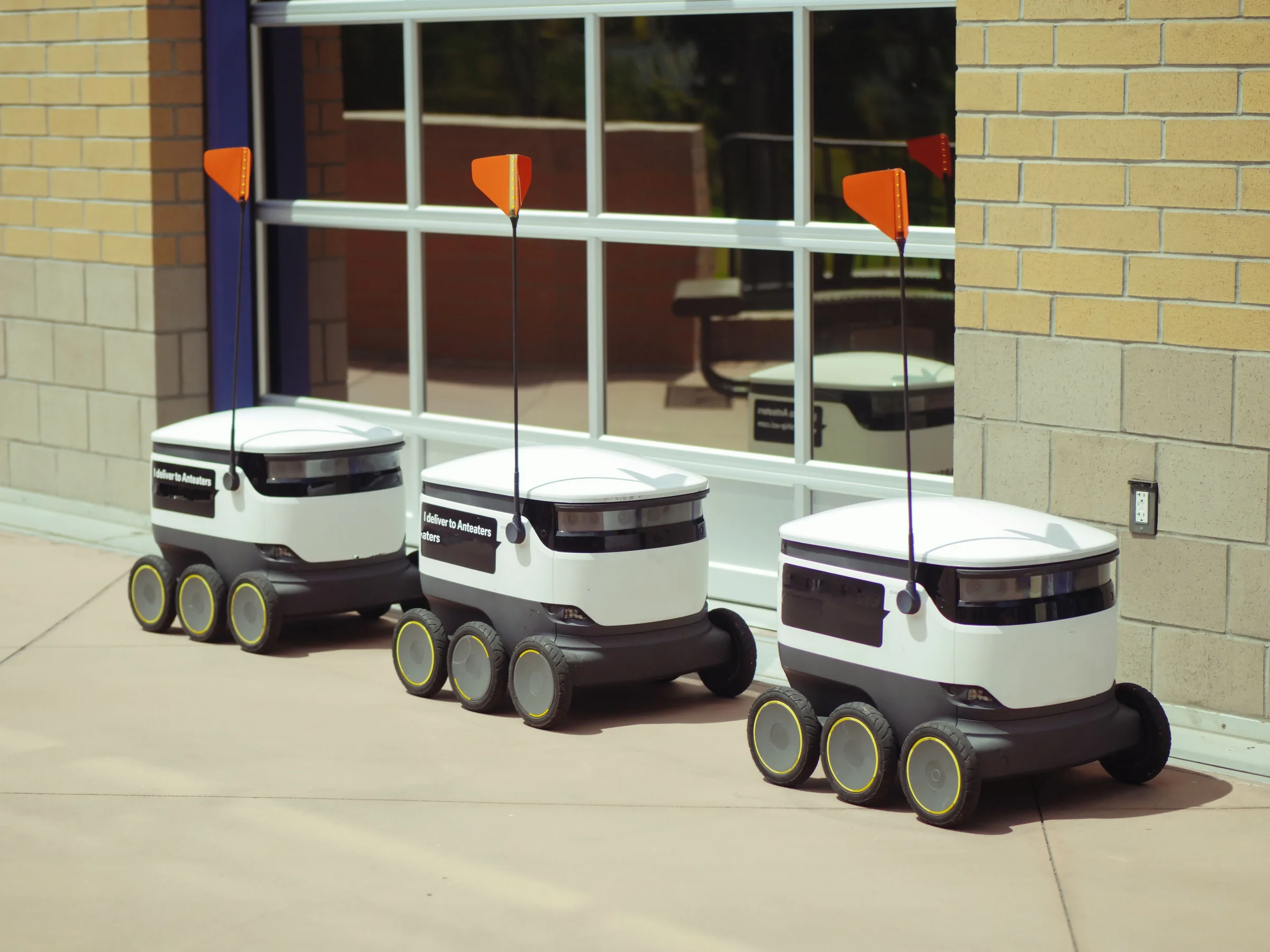 A group of autonomous delivery robots prepared for operation